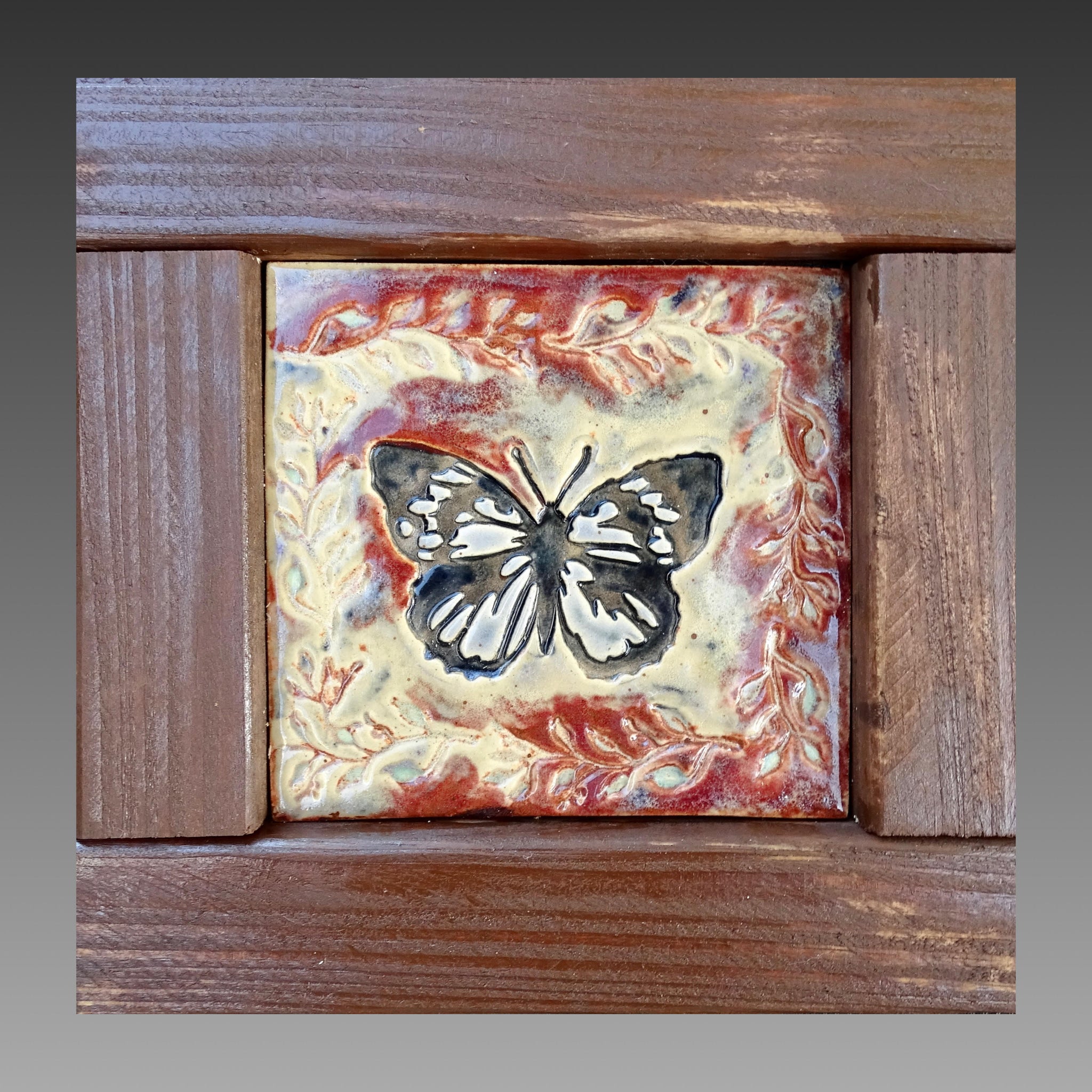 Hnamdade clay art in wooden frame with butterfly and leaves