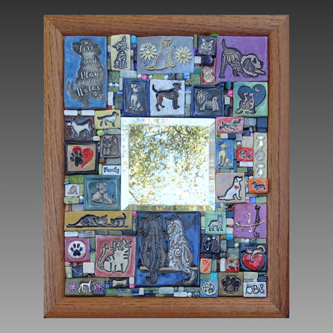 Mosaic pet-themed artwork with dogs, cats, hearts, and pawprints 